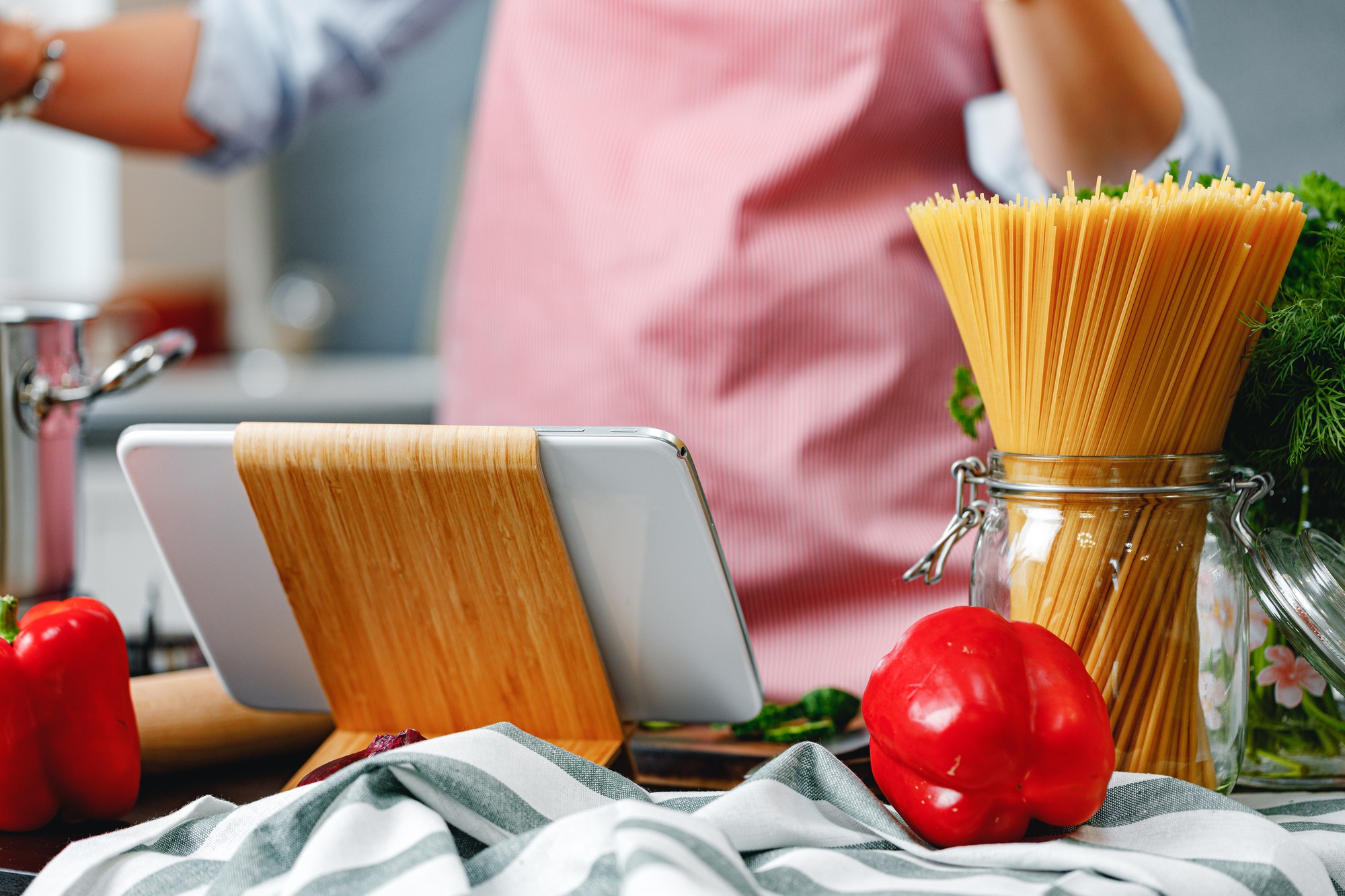 Workspace with cooking equipment and laptop for online class