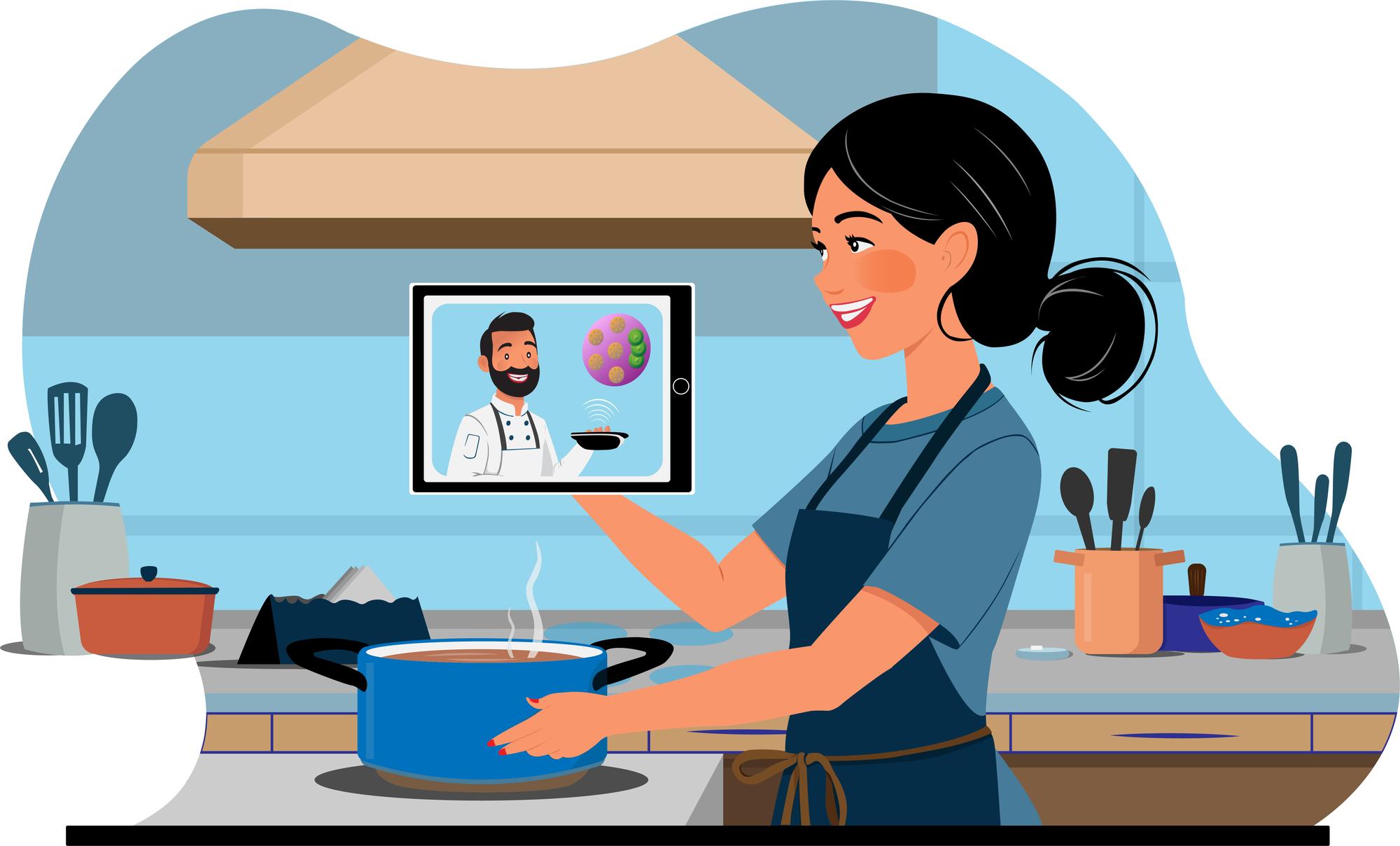 Instructor guiding a student via video call in a kitchen